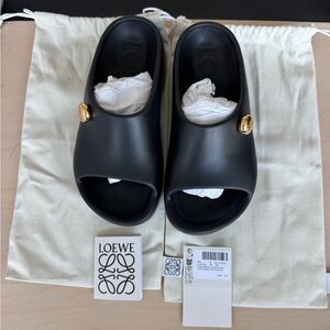 LOEWE
Foam Pebble Slides with gold accent logo